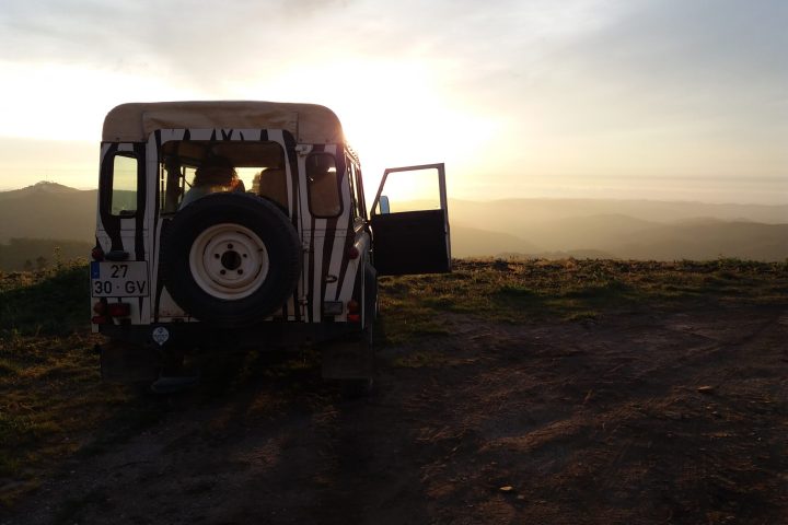 a truck parked on a dirt road