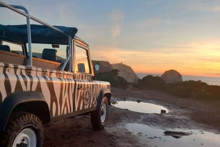 a truck parked on a dirt road