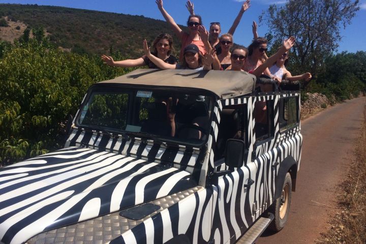 a group of people on a jeep tour