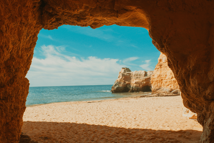 a rocky beach next to a body of water
